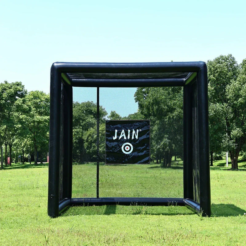A black 10x10x10ft FunJain inflatable baseball hitting station with fully enclosed netting and a central bullseye target, set up on a grassy lawn for home practice.